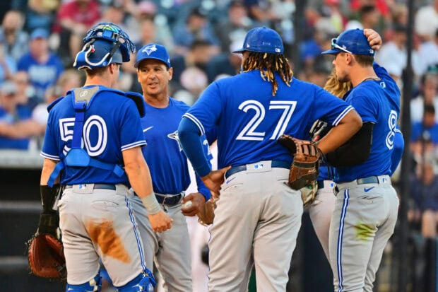 Toronto Blue Jays players in a team meeting during a baseball game