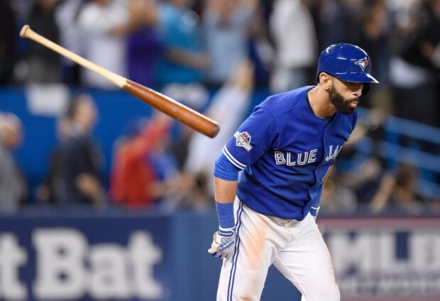A Toronto Blue Jays player celebrates after hitting a home run during a crucial game