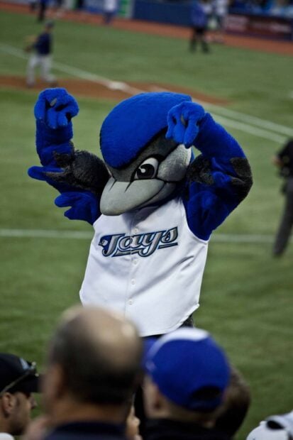 The Toronto Blue Jays mascot cheering on fans at the baseball stadium