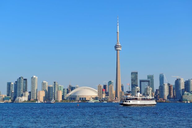 Toronto skyline featuring the CN Tower and waterfront buildings on a clear day