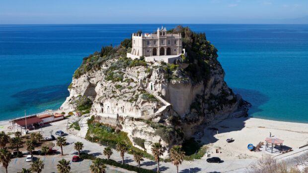 Historic Tropea coastal cliff with building and ocean view in clear weather