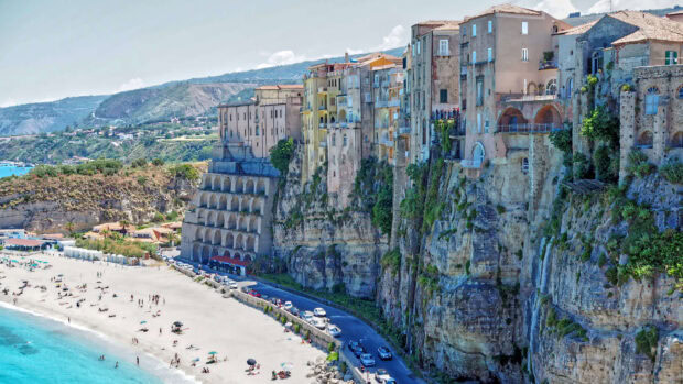 Historic Tropea town built on cliffs overlooking the beach and turquoise sea in Tropea