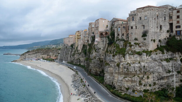 Historic cliffside buildings overlooking the coast at Tropea in Italy