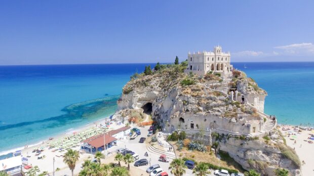The Tropea cliff overlooking the clear sea and sandy beach in Tropea