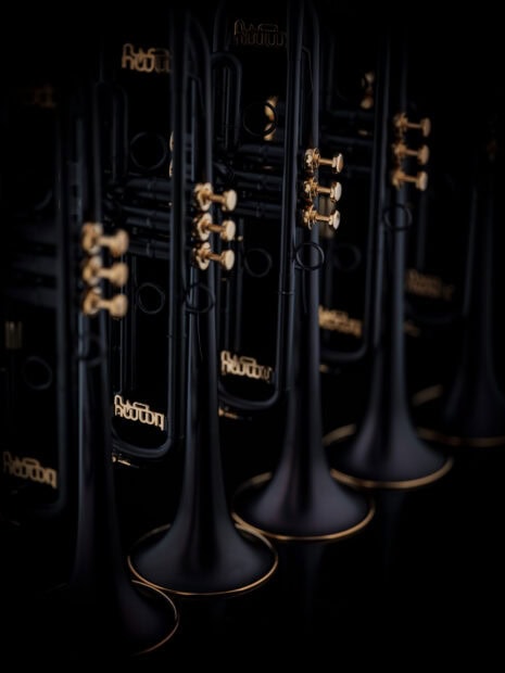 Close up of black trumpet valves and tubes in artistic composition