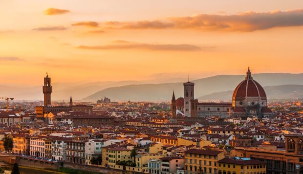 Historic Tuscan cityscape featuring Florence skyline at sunset with cathedral and towers