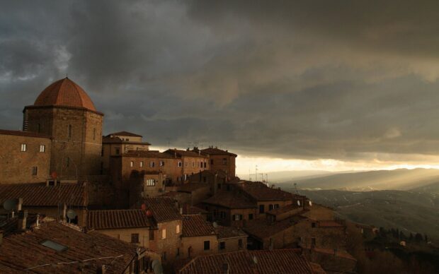 Ancient Tuscany townscape under a dramatic cloudy sky in Tuscany