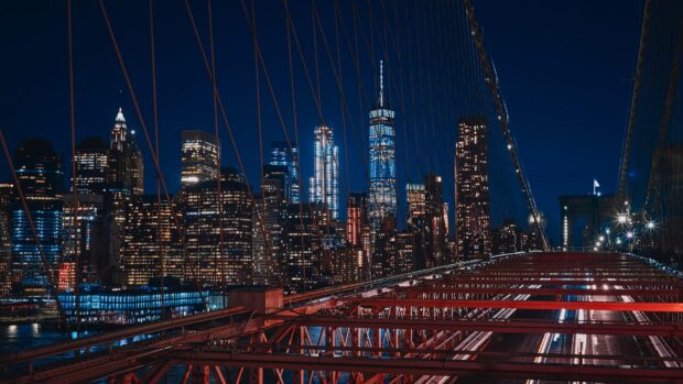 Nighttime cityscape with usa skyline and illuminated bridge structure