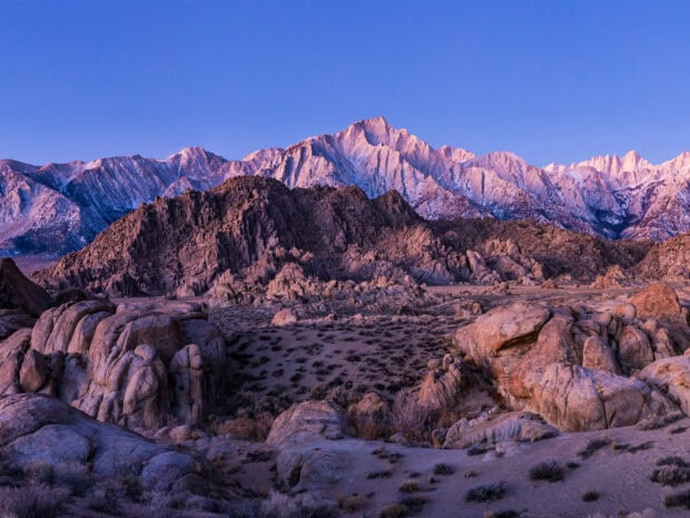 Rocky mountainous landscape with usa mountain range in purple sunset light