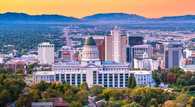 Utah cityscape with historic capitol building and mountain range in the background