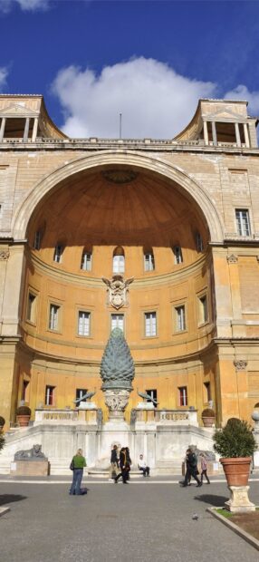 The Vatican City courtyard with the iconic pinecone sculpture and surrounding architecture