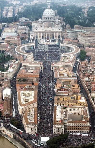 Aerial view of Vatican City filled with people during a major event in the city