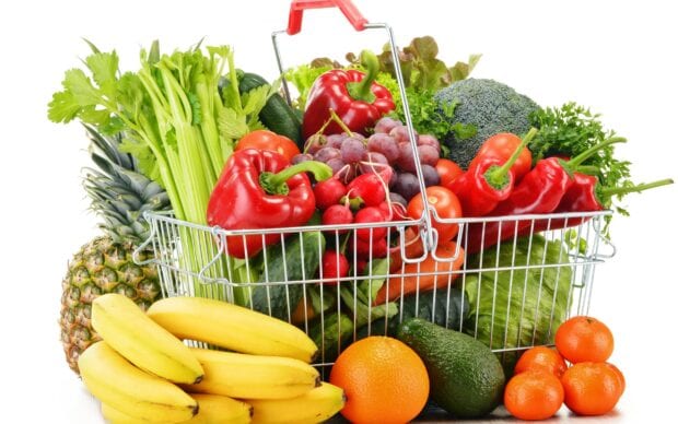 Fresh vegetables basket with celery broccoli and bell pepper on white background
