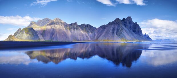 Stunning Vestrahorn Iceland landscape with mountain reflection on the calm water