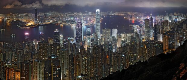Nighttime cityscape at Victoria Peak with vibrant lights and bustling urban skyline