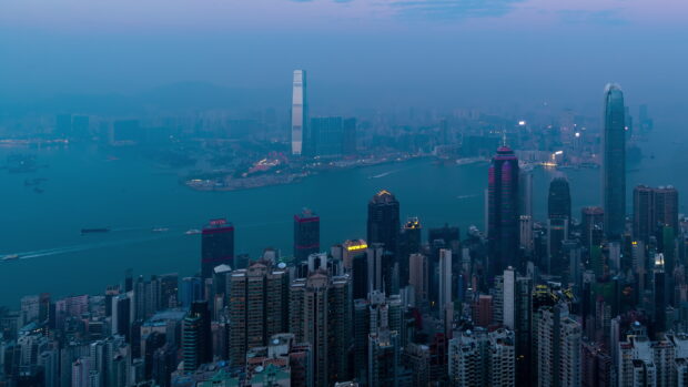 Victoria Peak cityscape with skyscrapers and harbor view at dusk