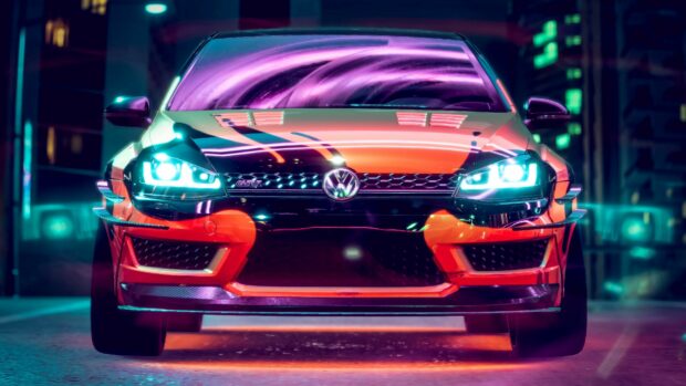 Front view of a Volkswagen GTI car illuminated with neon lights in the city at night