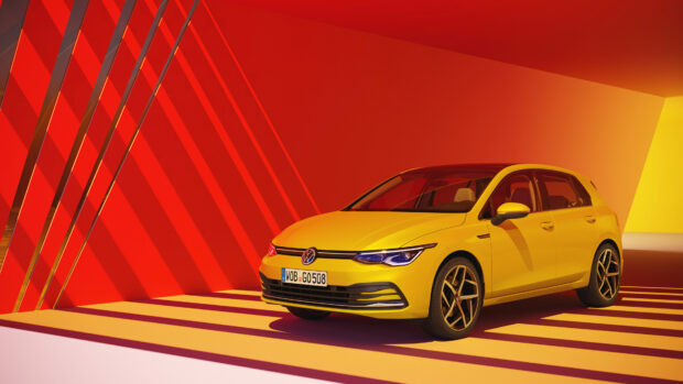 Yellow Volkswagen car in a vibrant red and yellow geometric setting