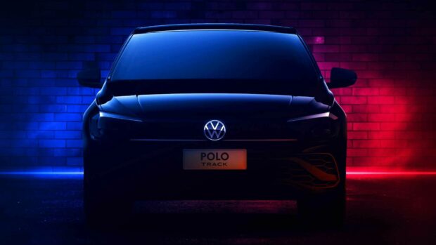 Front view of Volkswagen Polo Track car with illuminated logo on a brick wall background