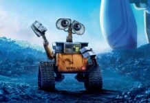 A rusty robot exploring a futuristic wasteland with bright blue skies and scattered debris around