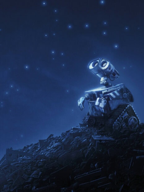 Wall e robot exploring junkyard under starry sky at night