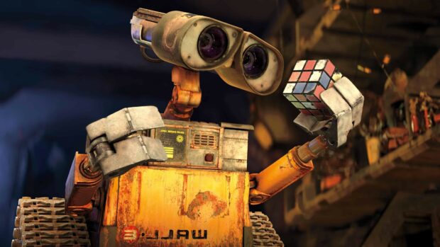 Wall e robot solving a colorful cube puzzle in a rusty workshop environment