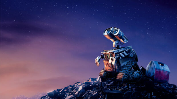 Wall E robot exploring a pile of trash under a starry night sky