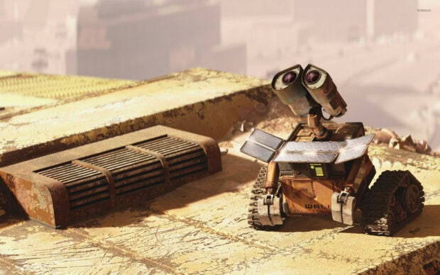 Rusted robot exploring a desert landscape with solar panels on a sandy surface
