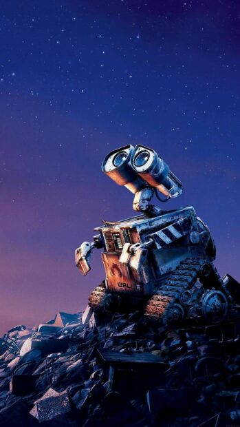 Walle robot exploring a junkyard under a starry night sky