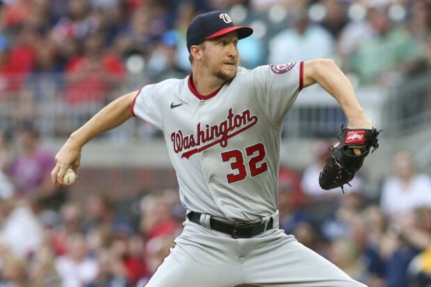A Washington pitcher in action wearing a gray uniform with number 32 during a baseball game