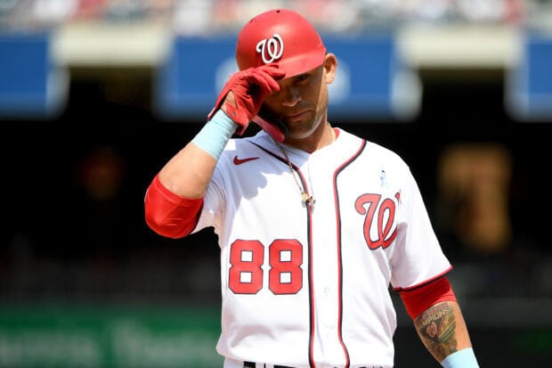 Washington Nationals player wearing number 88 uniform adjusting cap on the field