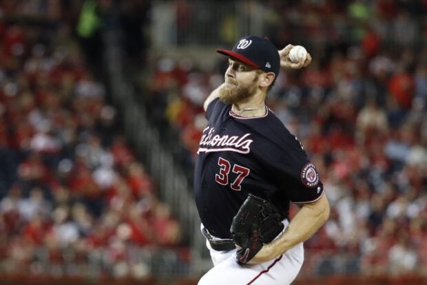A Washington Nationals player pitching during a baseball game at the stadium