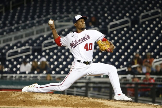 A Washington Nationals player pitching during a baseball game on the mound