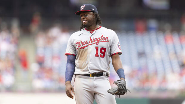 A Washington baseball player wearing number 19 standing on the field during a game
