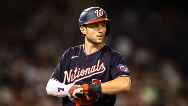 Washington Nationals player wearing helmet and uniform preparing to bat during a game
