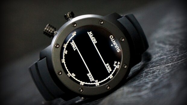 Dive watch with digital display showing time and depth measurements
