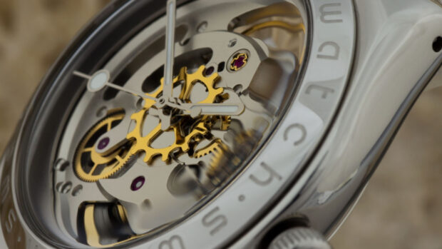 Close up view of mechanical watch gears and clock hands in luxury timepiece