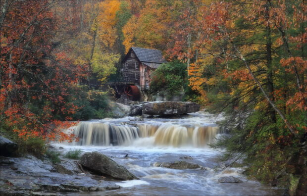 Old Wooden Mill Surrounded by West Virginia Autumn Forest and Waterfall