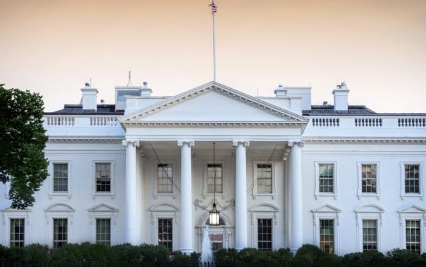 The White House classic architecture with columns under a soft evening sky