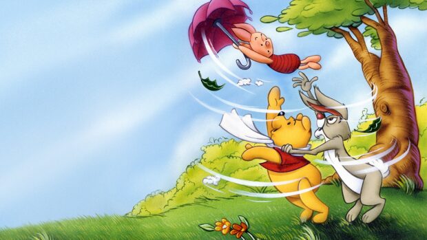 Winnie The Pooh and friends are caught in a swirling wind near a tree on a grassy hill