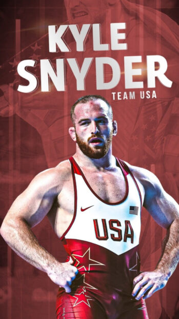 Kyle Snyder wearing USA wrestling suit standing confidently in red background