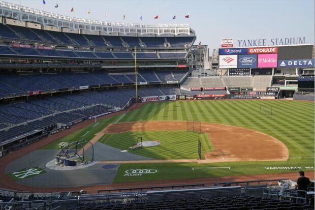 The field view of Yankee Stadium baseball park with empty stands and clear sky