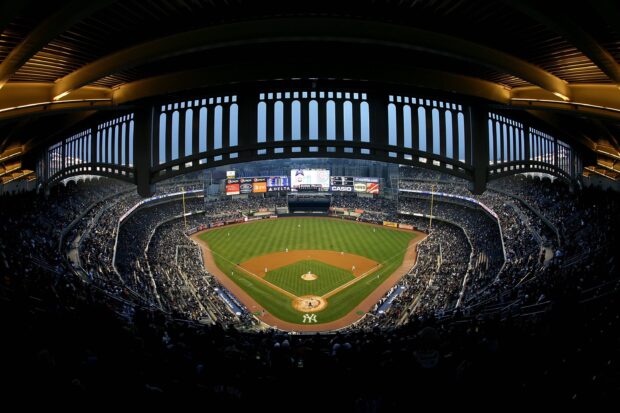 A panoramic view of Yankee Stadium filled with spectators during a baseball game at Yankee Stadium