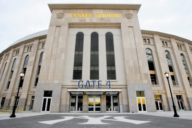 Main entrance of Yankee Stadium with Gate 4 and large windows at sunset