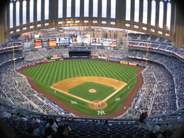 A wide view of Yankee Stadium showing the baseball field and stands during a game
