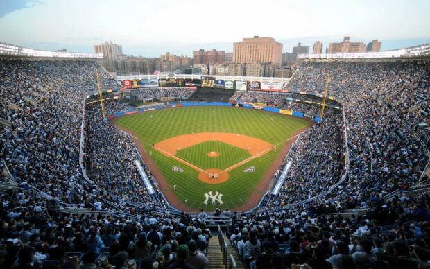 A panoramic view of Yankee Stadium filled with fans during a baseball game at the stadium