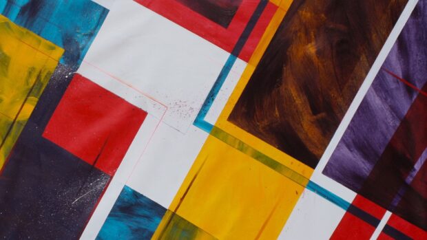 Abstract shape featuring colorful geometric forms and brush strokes in vibrant hues