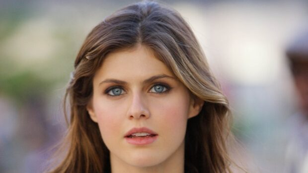 Alexandra Daddario with blue eyes and flowing hair looking directly at the camera