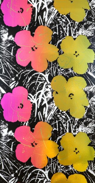 Colorful floral design by Andy Warhol with pink and yellow flowers on black and white background