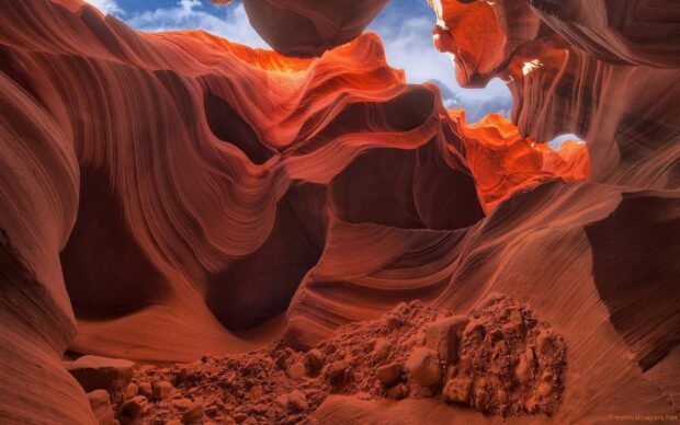 Natural rock formations in Antelope Canyon showcasing smooth curves and intricate patterns